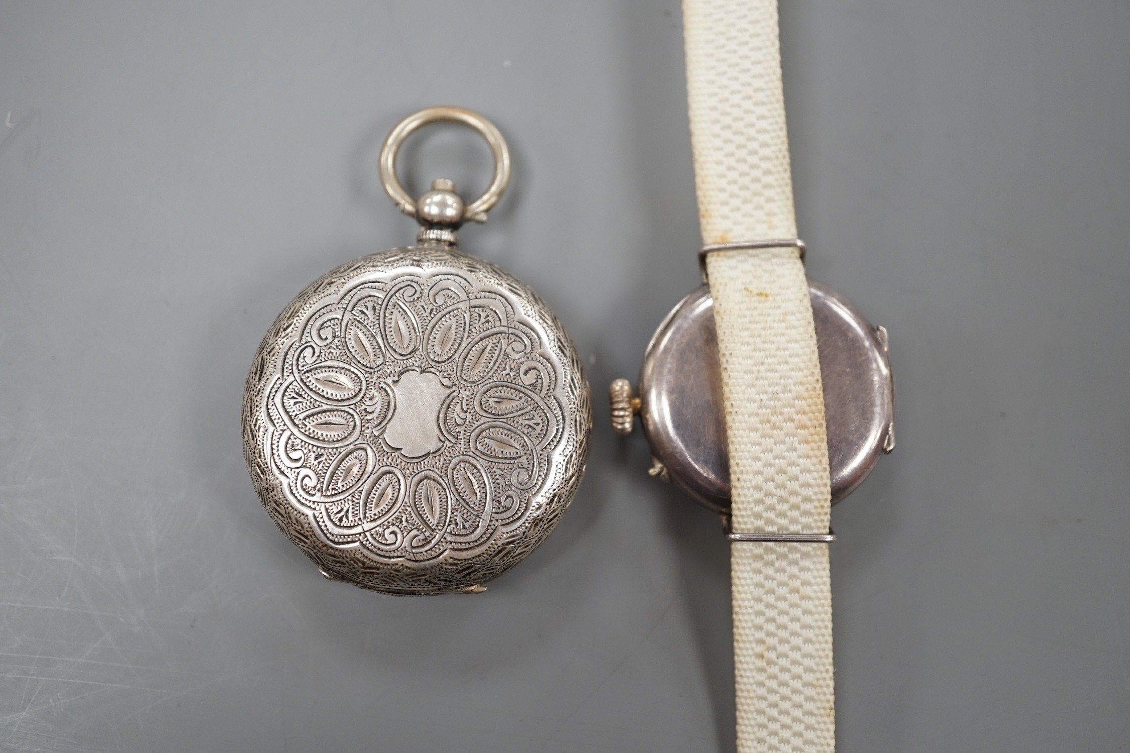 A lady's early 20th century silver and enamel manual wind wrist watch and an 800 standard white metal fob watch.